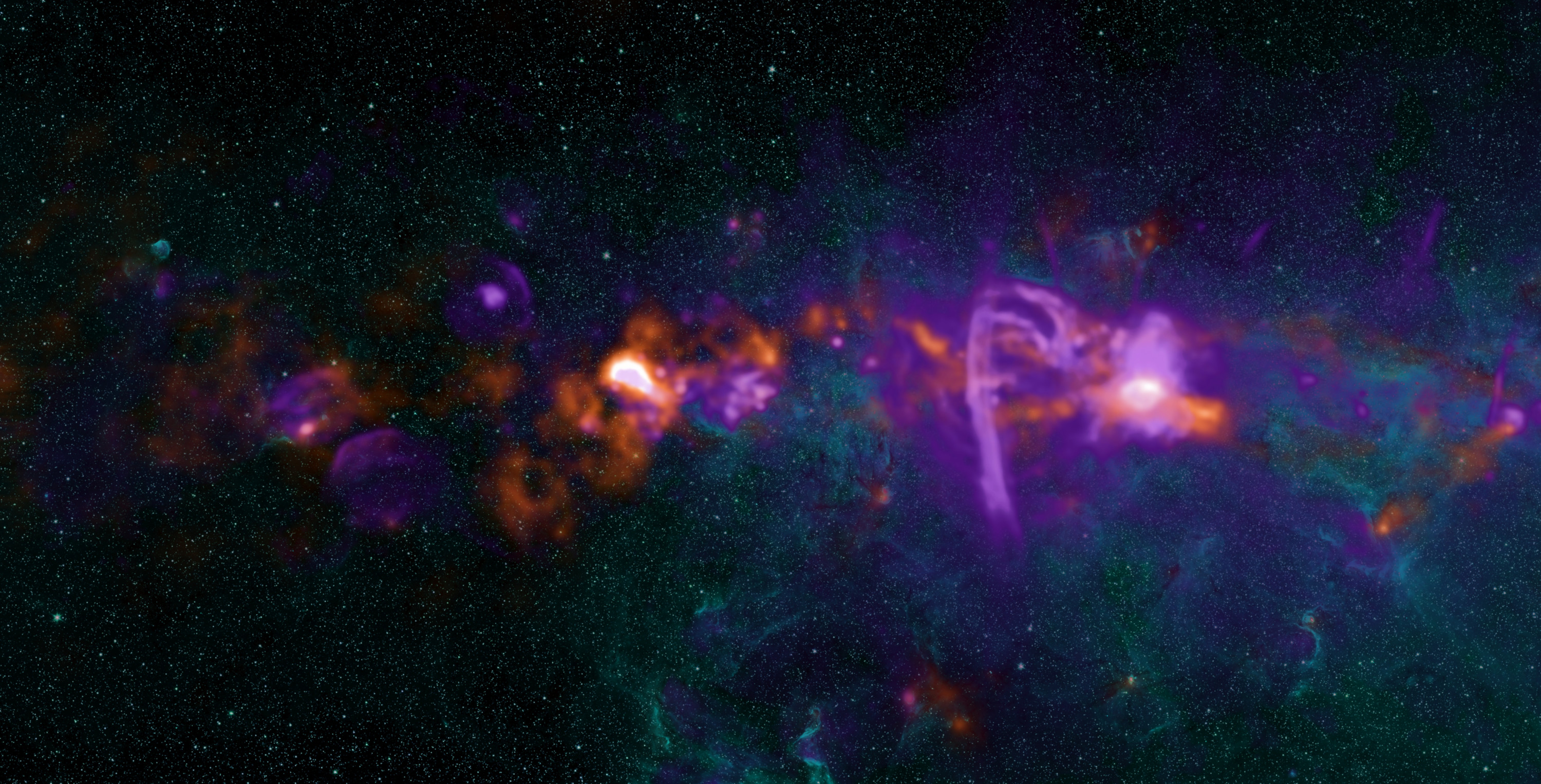 電波で見た天の川銀河の中心付近の様子。右寄りの明るい天体が、超巨大ブラックホールに対応する「いて座A*」です。
The view of the centre of our galaxy with a closer view of the object known as Sagittarius A*, the bright radio source that corresponds to the supermassive black hole.
Credit: NRAO/AUI/NSF