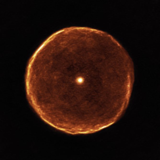 Delicate bubble of expelled material around the cool red star U