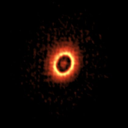 アルマ望遠鏡がとらえた若い星おうし座DM星のまわりの塵の円盤