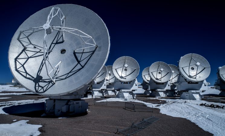 Dark blue sky and antennas of the ALMA Morita Array