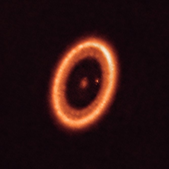The PDS 70 system as seen with ALMA