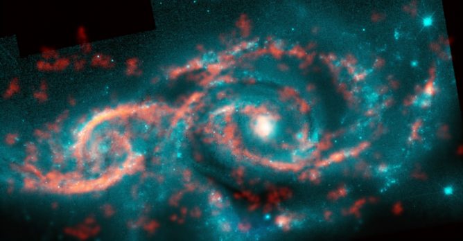 Tsunami of Stars and Gas Produces Dazzling Eye-shaped Feature in Galaxy